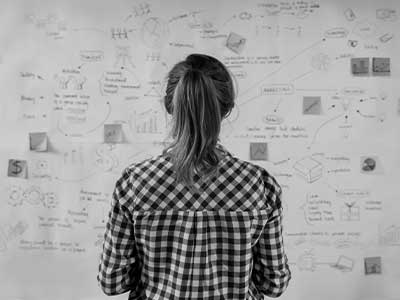 Woman facing wall of notes